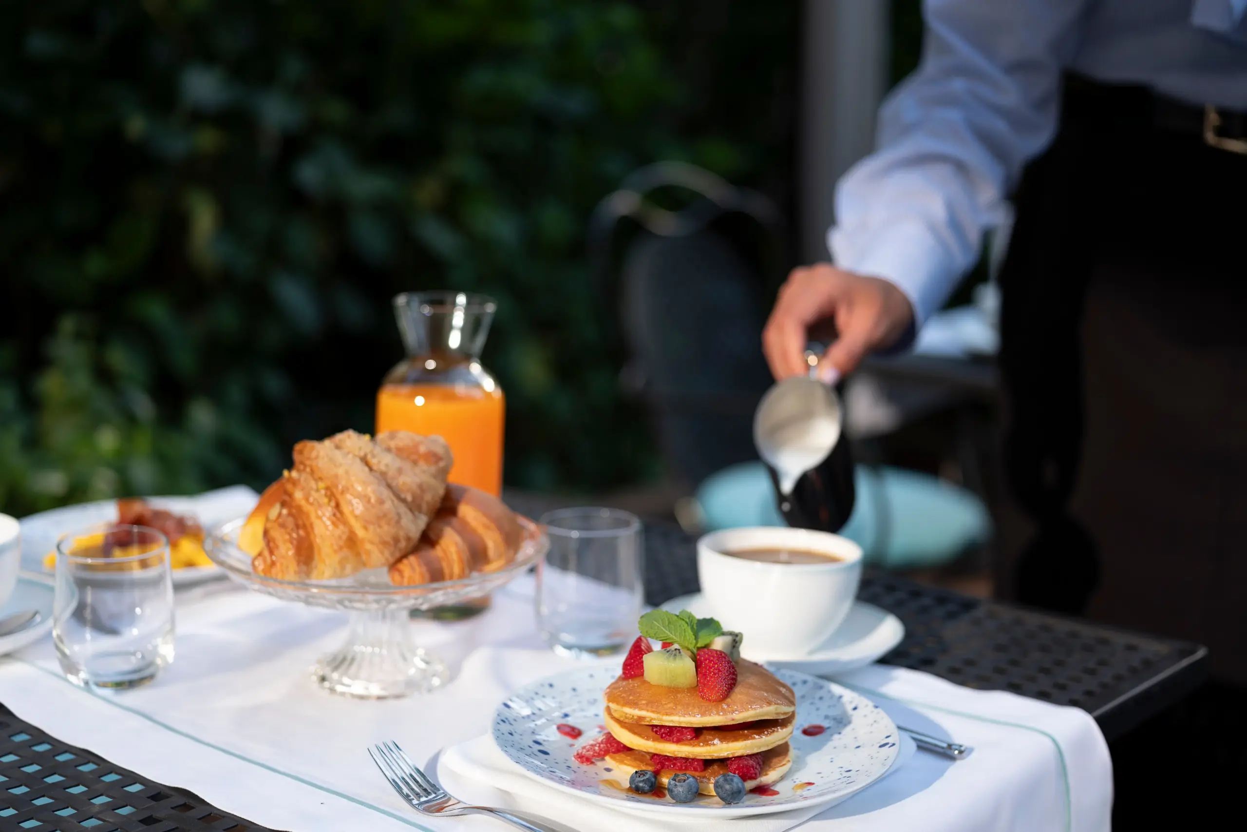 pancakes and croissants for breakfast on the terrace at Park Hotel Desenzano